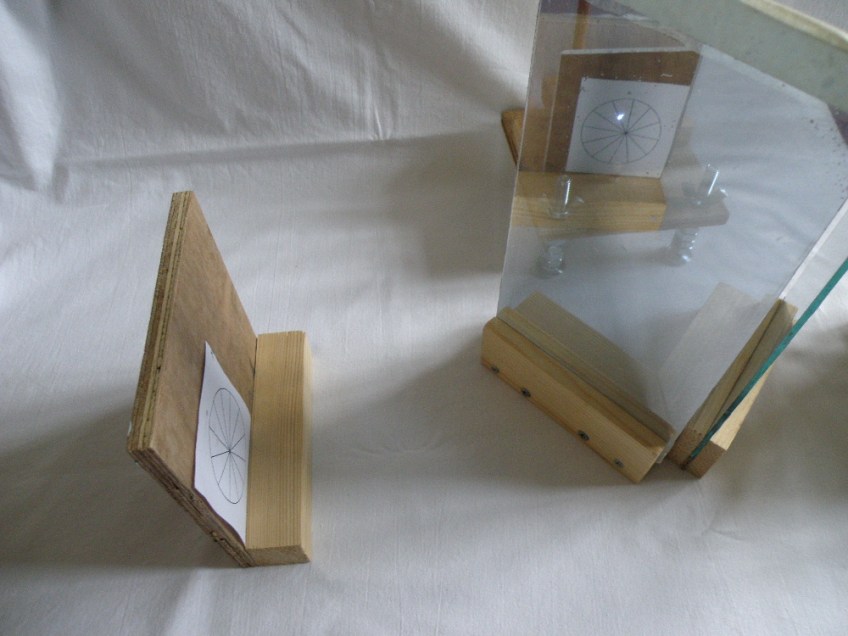 See where the pin-prick of light falls in the image. The pencil fixed in the base of the plotter can record this on the plotting table.